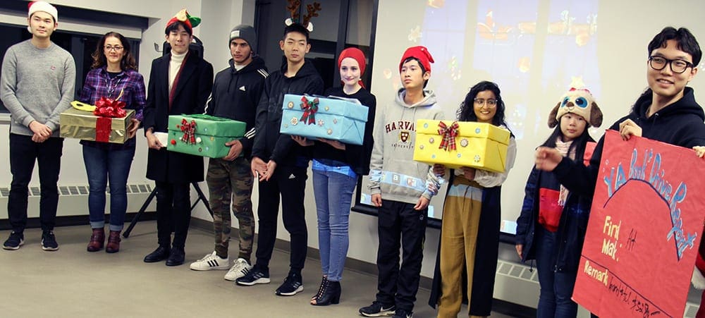 Vancouver high school students deliver over 1,200 items in book drive for refugee and immigrant youth at ISSofBC