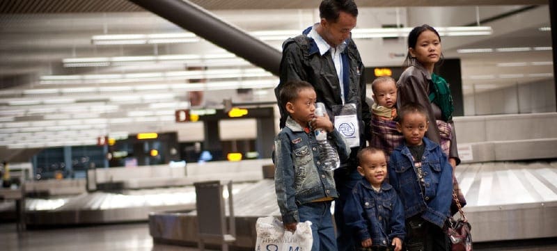  Government-Assisted Refugee family arrives at the airport in Canada.