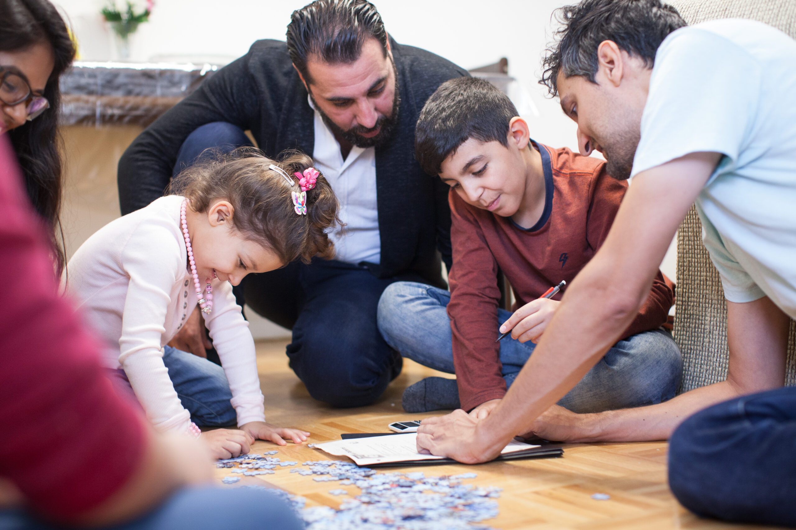 Together Project volunteers helping children with homework. Credit: Lisa Kannakko
