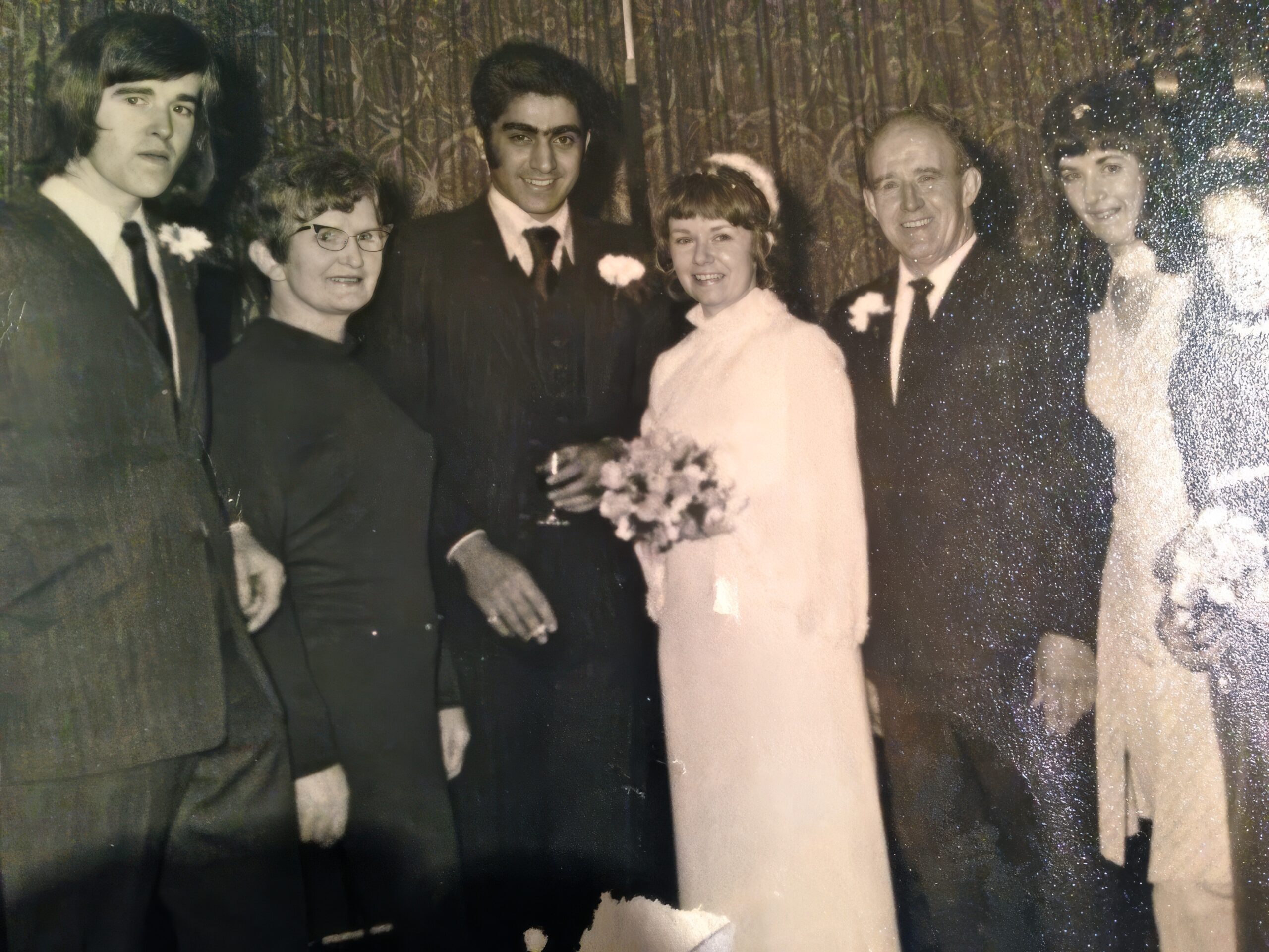 Black and white wedding photo of Rebecca’s parents, representing a family history shaped by migration and resilience.